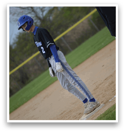 A baseball player wearing a blue and black uniform. Description generated by AI