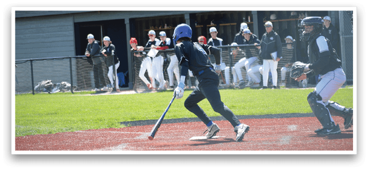 A baseball player is swinging a bat on a field. Description generated by AI