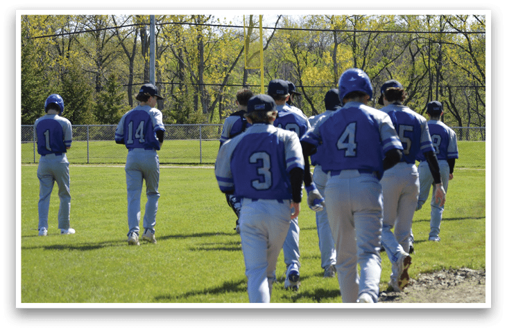 A group of baseball players walking on the field. Description generated by AI
