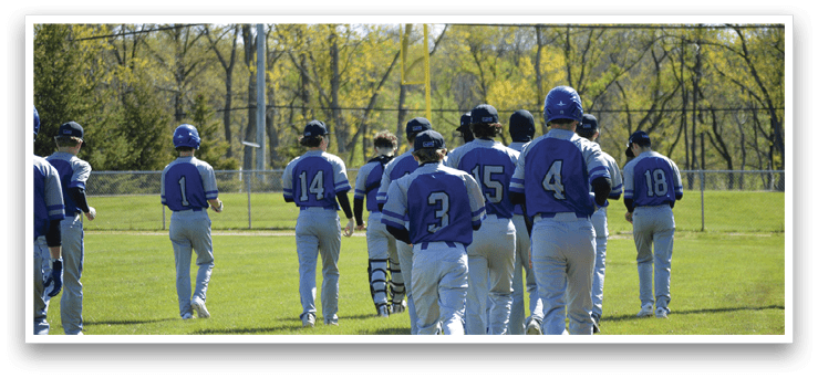 A group of baseball players walking on a field. Description generated by AI