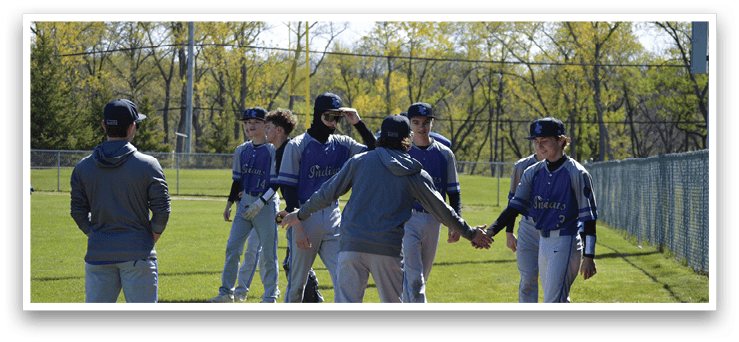 A group of baseball players on a field. Description generated by AI