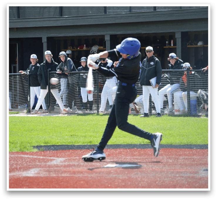 A baseball player is swinging a bat at a ball. Description generated by AI