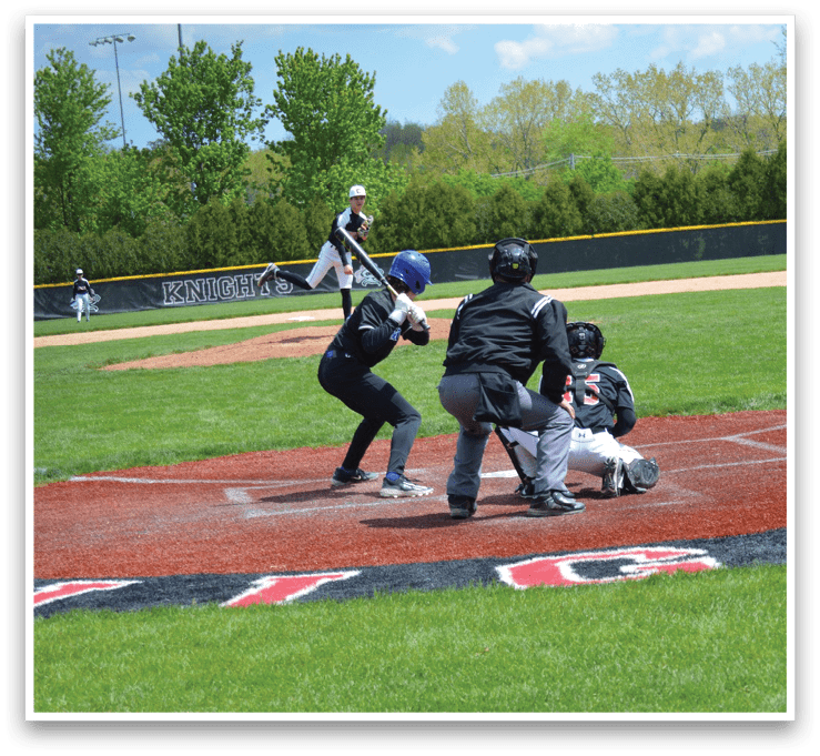 A baseball game is taking place on a field. Description generated by AI