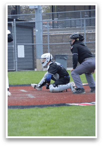 A baseball player is swinging a bat at a ball. Description generated by AI