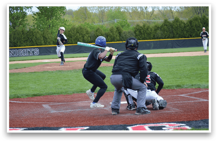 A baseball game is taking place with a batter swinging a bat. Description generated by AI