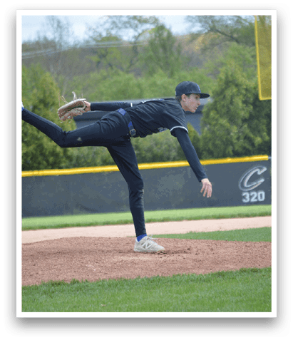 A baseball player in a black shirt and black pants is throwing a ball. Description generated by AI