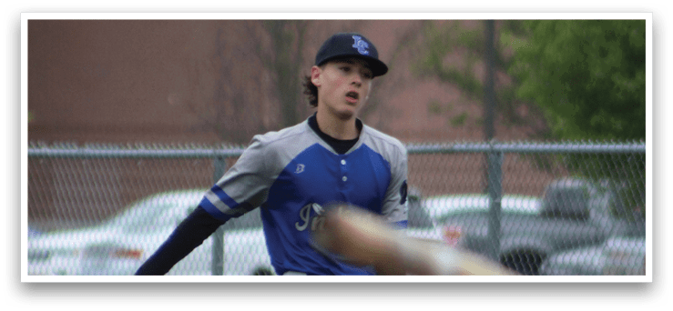 A baseball player in a blue and grey uniform is running towards a base. Description generated by AI