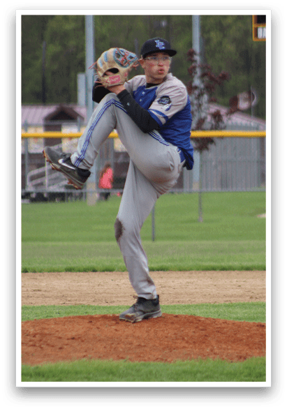 A baseball player in a grey uniform is throwing a ball. Description generated by AI