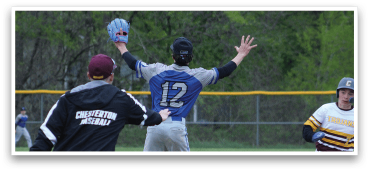 A baseball player wearing a blue shirt and red hat. Description generated by AI