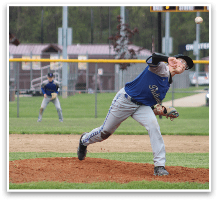 A baseball player in a blue shirt and white pants is pitching a ball. Description generated by AI