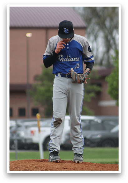 A baseball player wearing a blue and white uniform. Description generated by AI