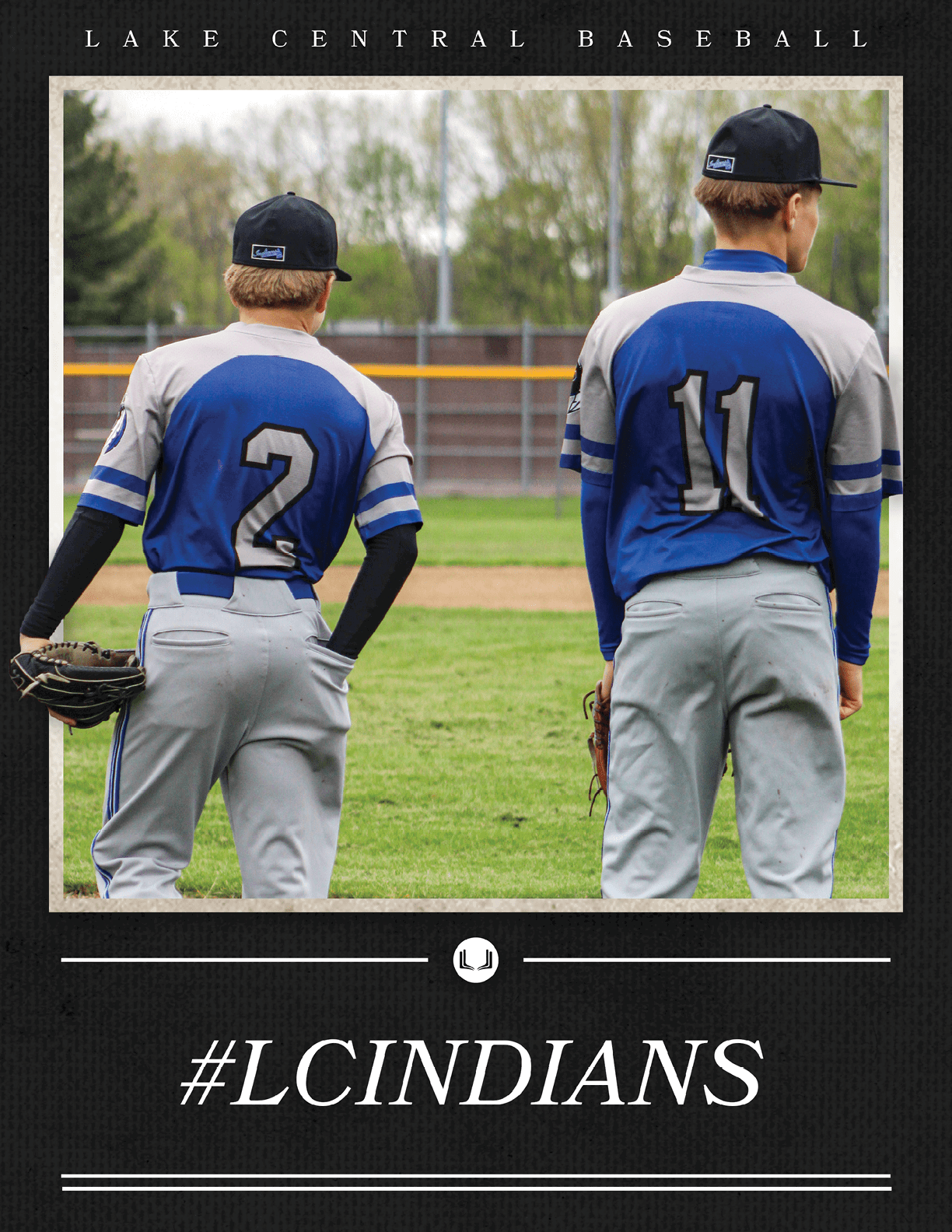 Two baseball players wearing blue and white uniforms. Description generated by AI