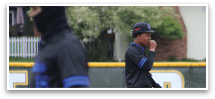 Two baseball players on a field. Description generated by AI