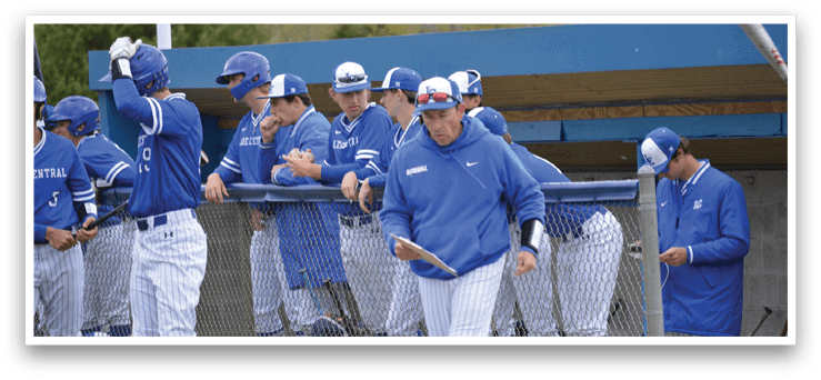A group of baseball players wearing blue and white uniforms. Description generated by AI