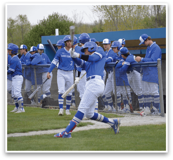 A baseball player holding a bat. Description generated by AI