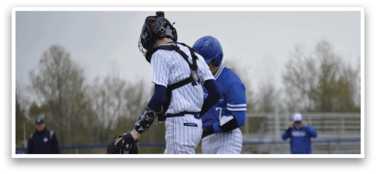 A baseball player wearing a blue helmet and white pants. Description generated by AI