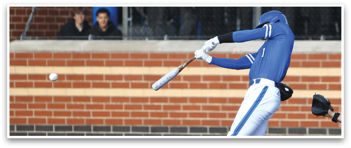 A baseball player is swinging a bat at a ball. Description generated by AI