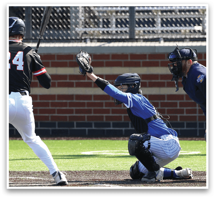 A baseball player is swinging a bat at a ball. Description generated by AI