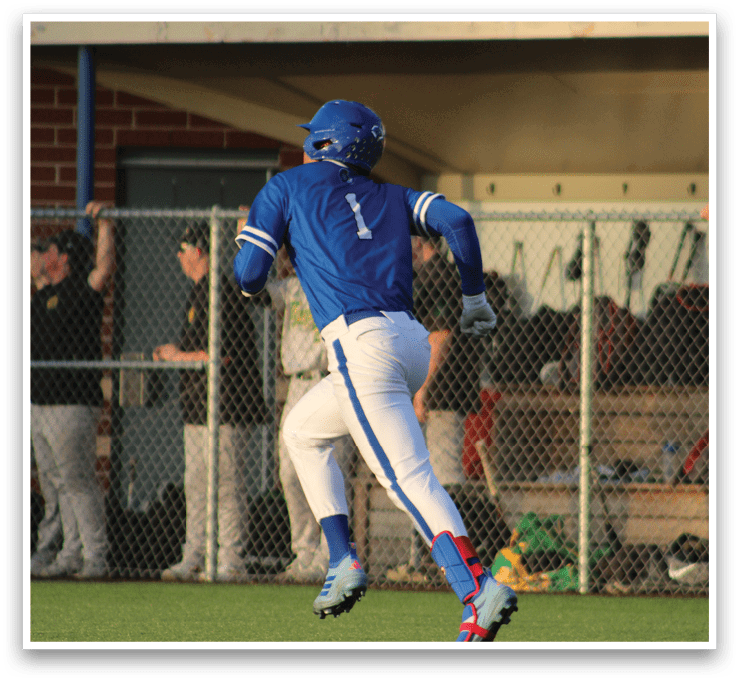 A baseball player sliding into a base. Description generated by AI