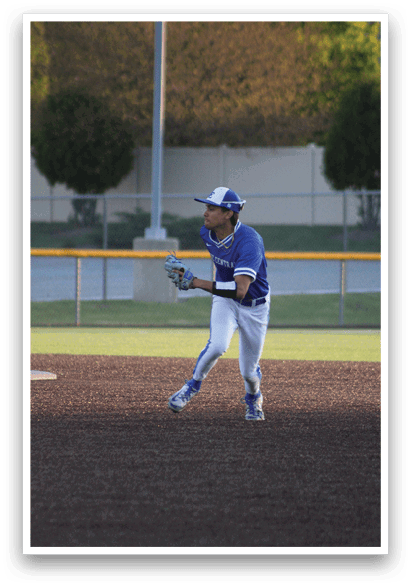 A baseball player wearing a blue shirt and white pants is running towards a base. Description generated by AI