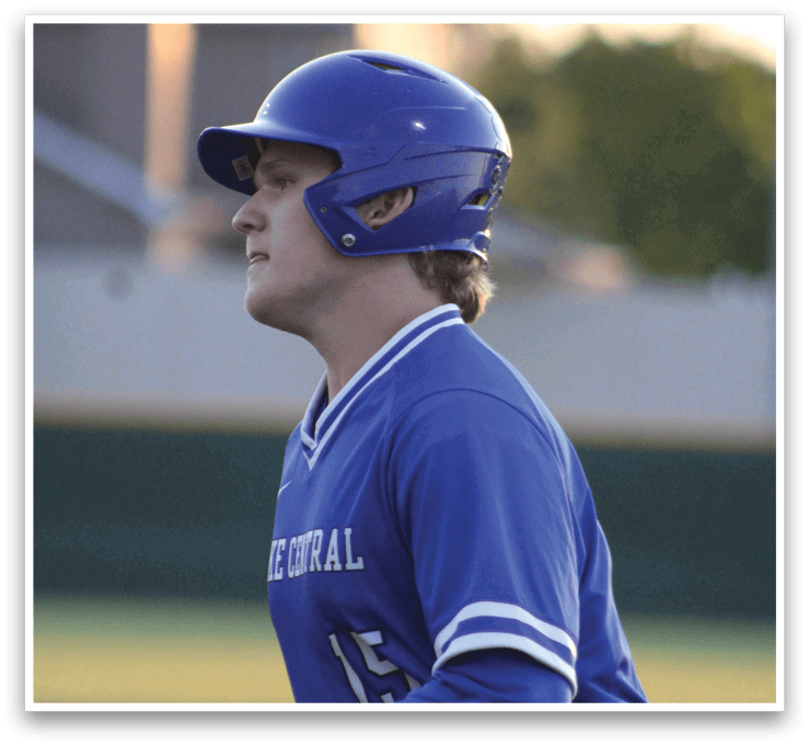 A baseball player wearing a blue and white uniform with the number 11 on the back. Description generated by AI