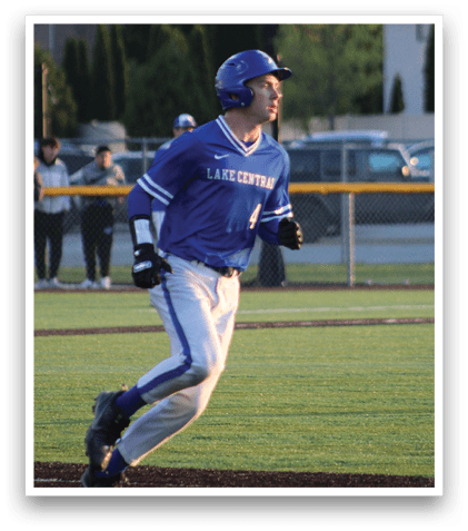 A baseball player wearing a blue shirt and blue hat. Description generated by AI