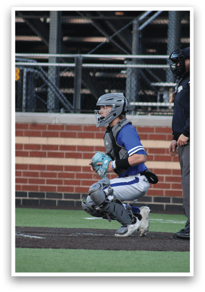 A baseball player is sitting on the ground with a catcher's mitt on his hand. Description generated by AI