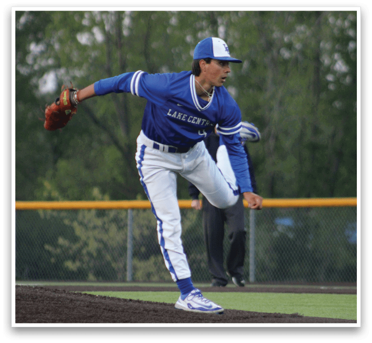 A baseball player in a blue uniform is pitching a ball. Description generated by AI