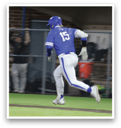 A baseball player running on the field. Description generated by AI