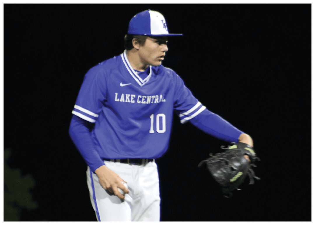 A baseball player wearing a blue and white uniform with the number 10 on it. Description generated by AI