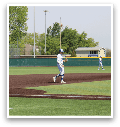 A baseball field with three players running. Description generated by AI