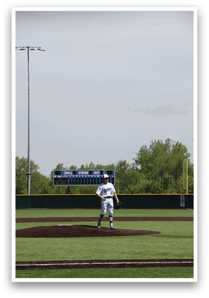 A baseball game is taking place on a field. Description generated by AI