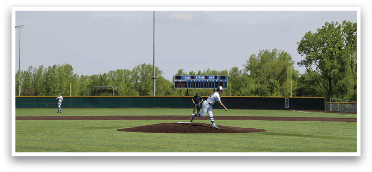 A baseball player is pitching a ball on a field. Description generated by AI