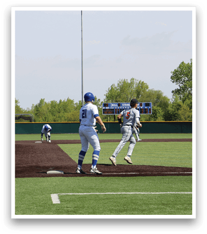 A baseball game is taking place on a field. Description generated by AI