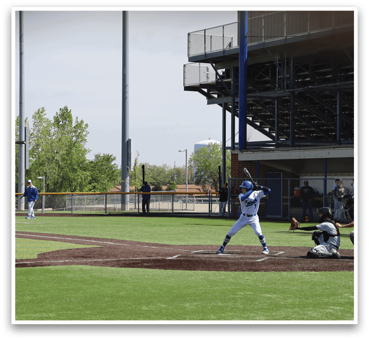 A baseball game is taking place on a field. Description generated by AI