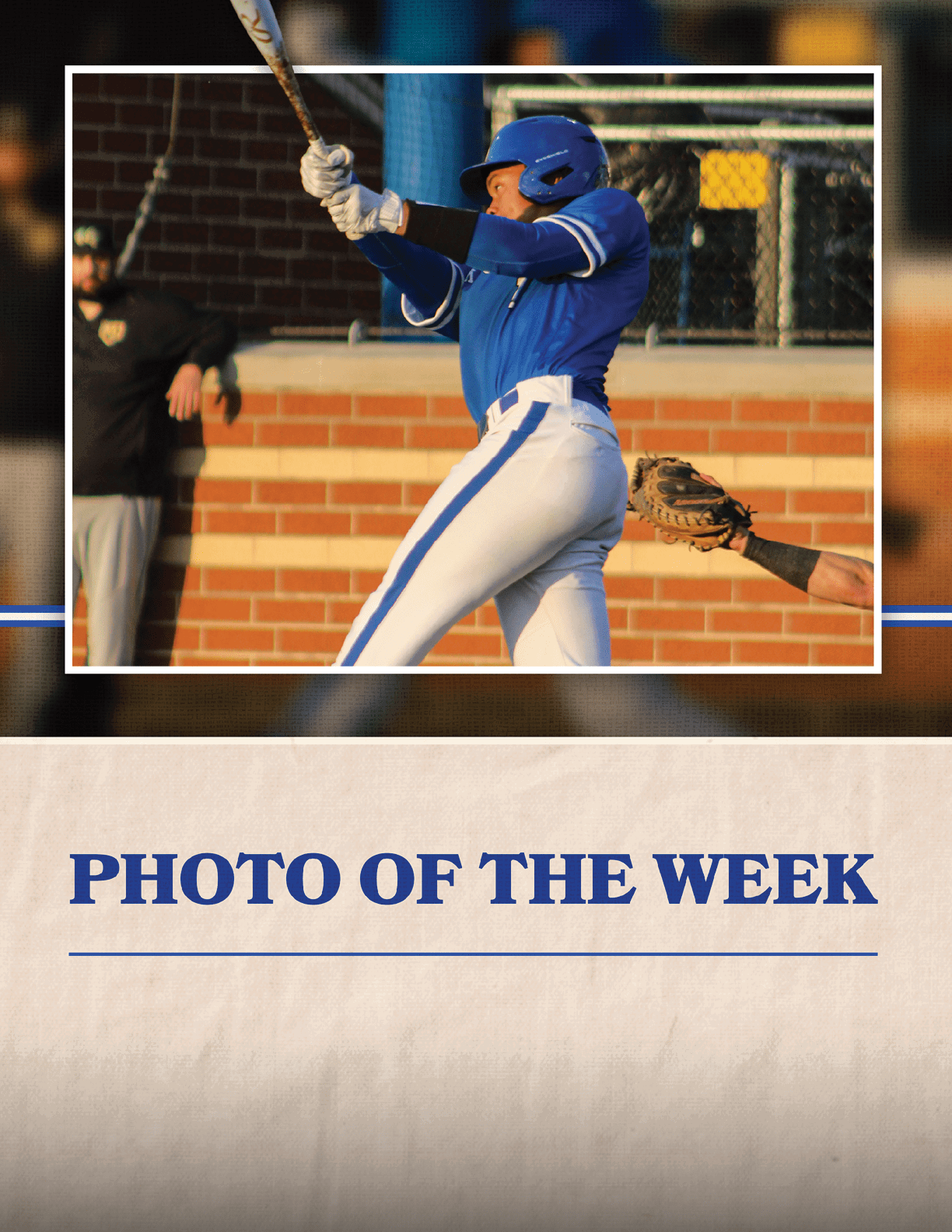 A baseball player in a blue and white uniform holding a bat. Description generated by AI