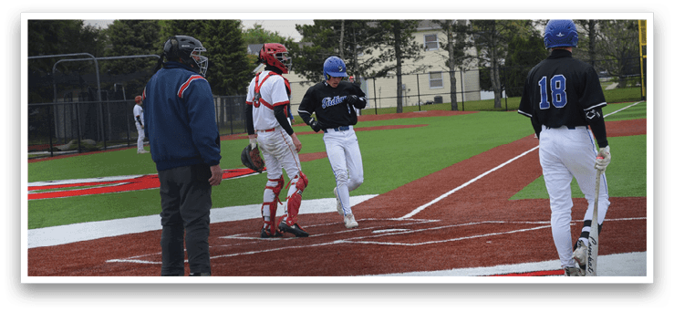 A baseball game is taking place with a man wearing a blue helmet. Description generated by AI