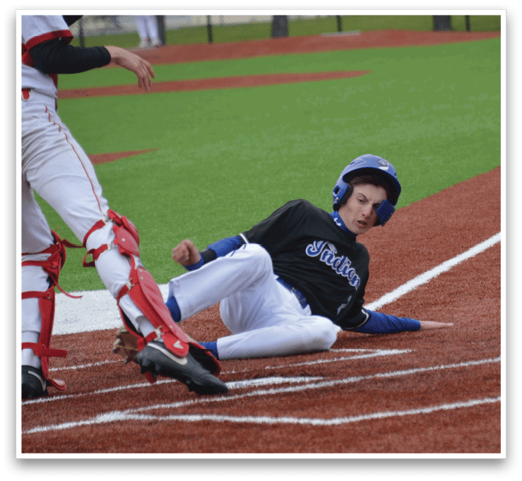 A baseball player slides into home base. Description generated by AI