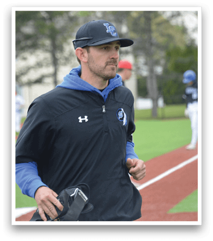 A man wearing a black jacket and blue shirt. Description generated by AI