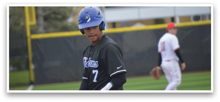 A baseball player wearing a blue helmet and black jersey. Description generated by AI