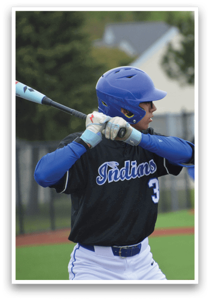 A baseball player in a blue helmet and black shirt is swinging a bat. Description generated by AI