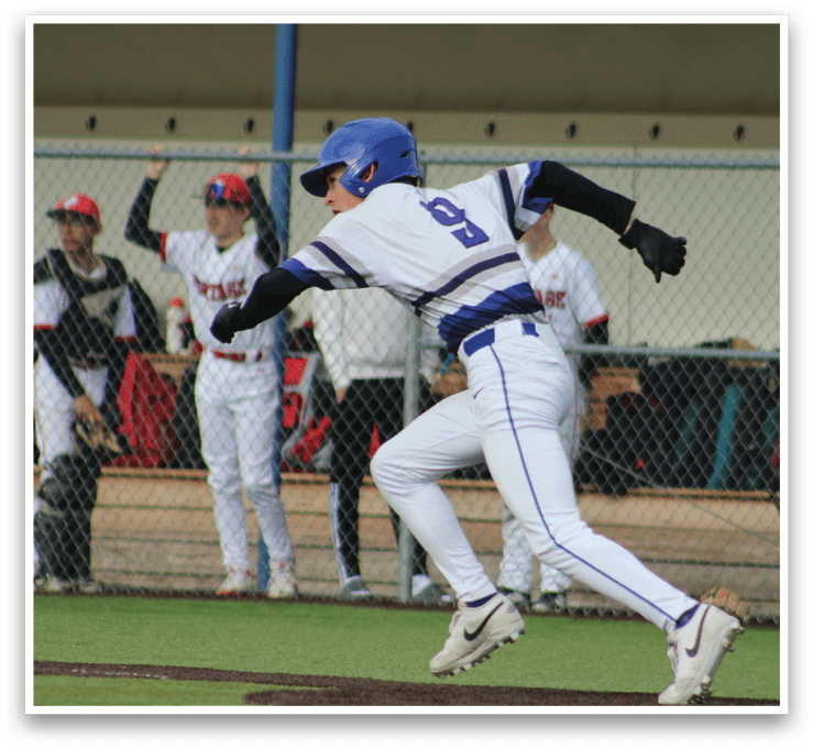 A baseball player wearing a blue helmet and white uniform is sliding into a base. Description generated by AI