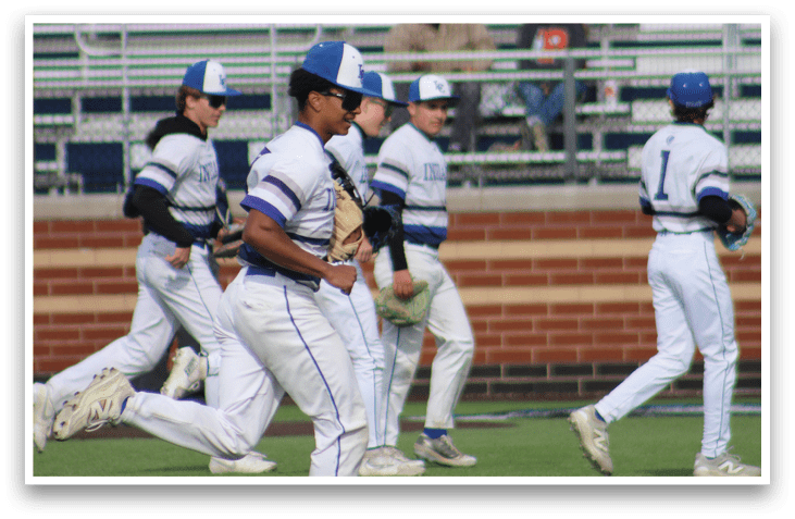 A group of baseball players on a field. Description generated by AI