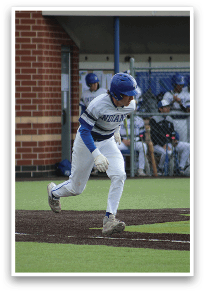 A baseball player in a white uniform is running towards home plate. Description generated by AI