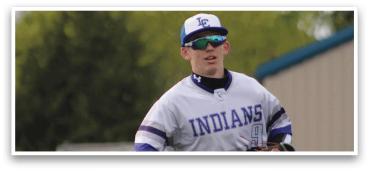 A baseball player wearing a blue and white uniform. Description generated by AI