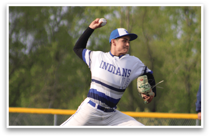 A baseball player in a blue and white uniform is throwing a ball. Description generated by AI