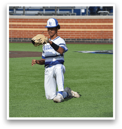 A baseball player kneeling on the field with a catcher's mitt. Description generated by AI
