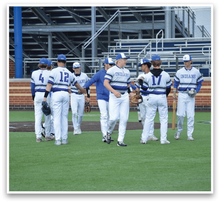 Baseball players wearing blue and white uniforms. Description generated by AI