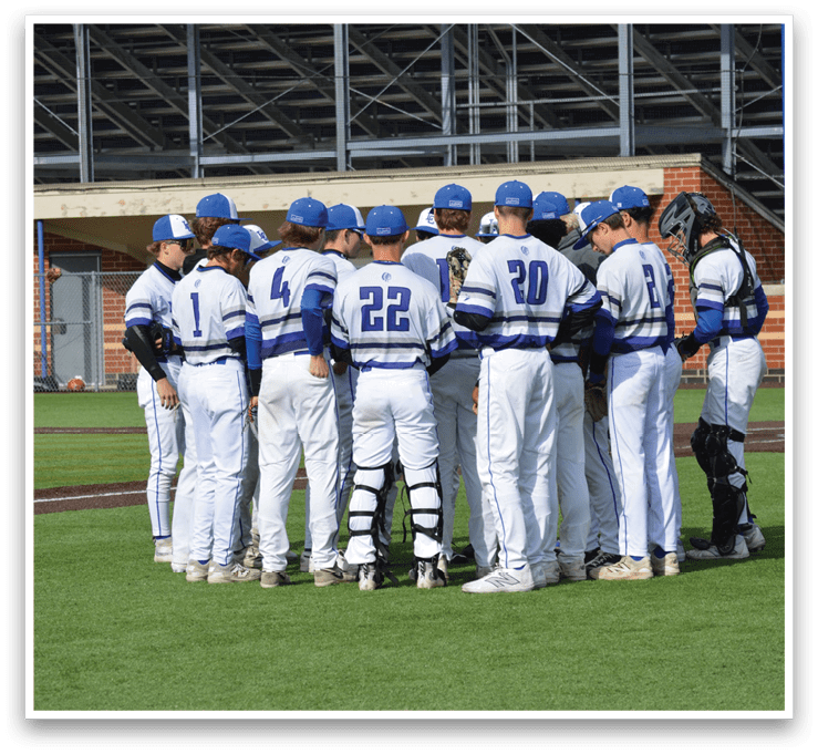 A group of baseball players wearing blue and white uniforms. Description generated by AI