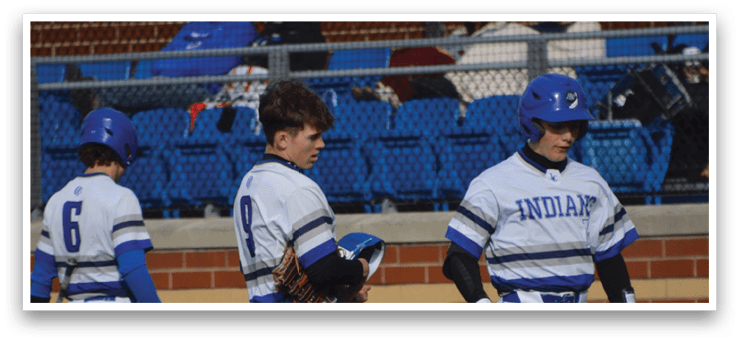 A group of baseball players walking on a field. Description generated by AI